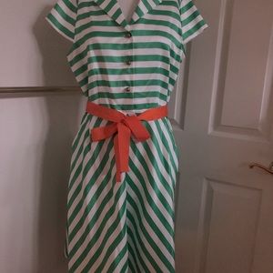 Green striped dress with orange tie belt.